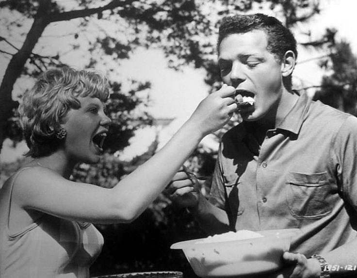 Hayley Mills helps James MacArthur with his lunch on the Spanish location of The Truth About Spring - 1965